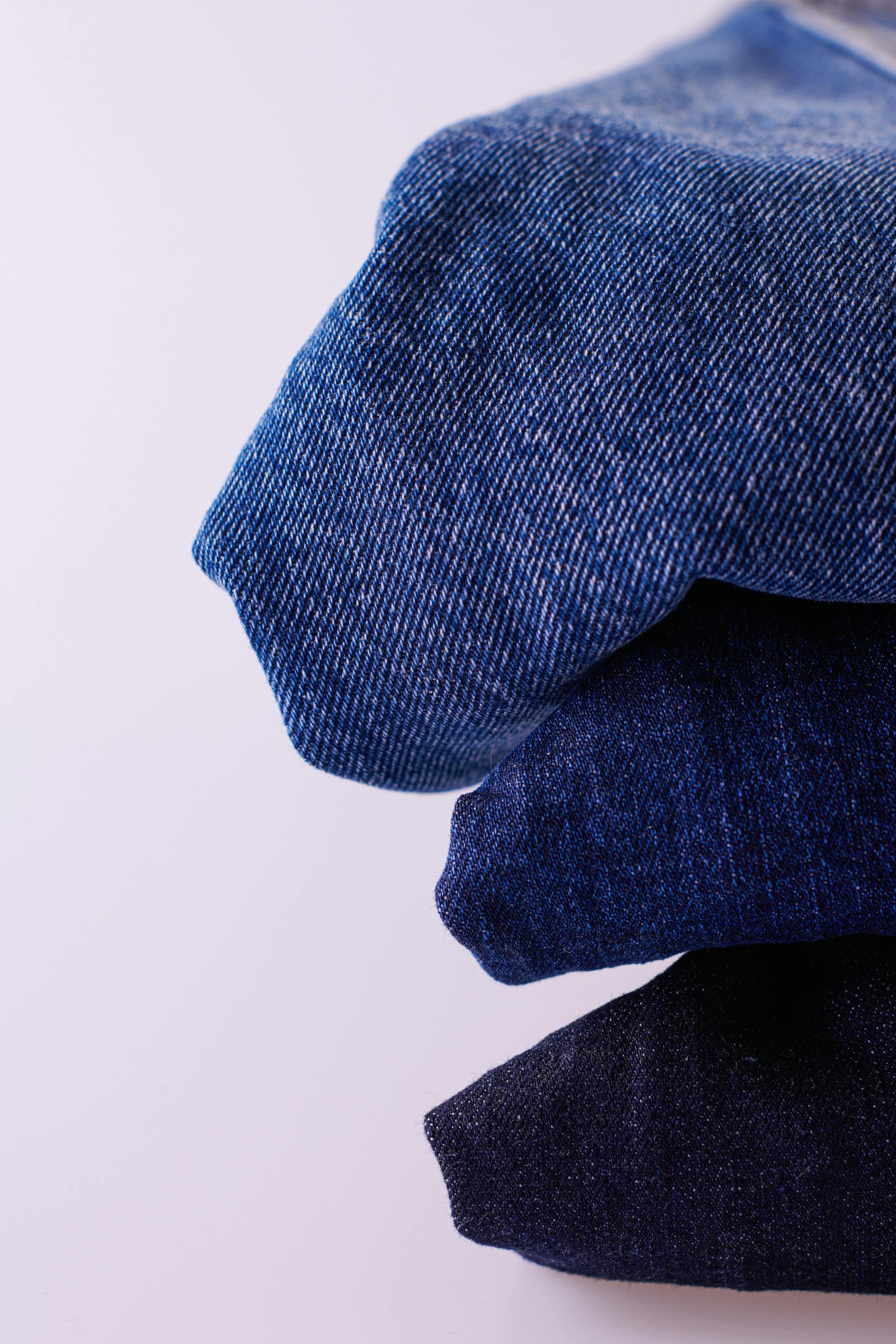 Stack of folded indigo denim jeans