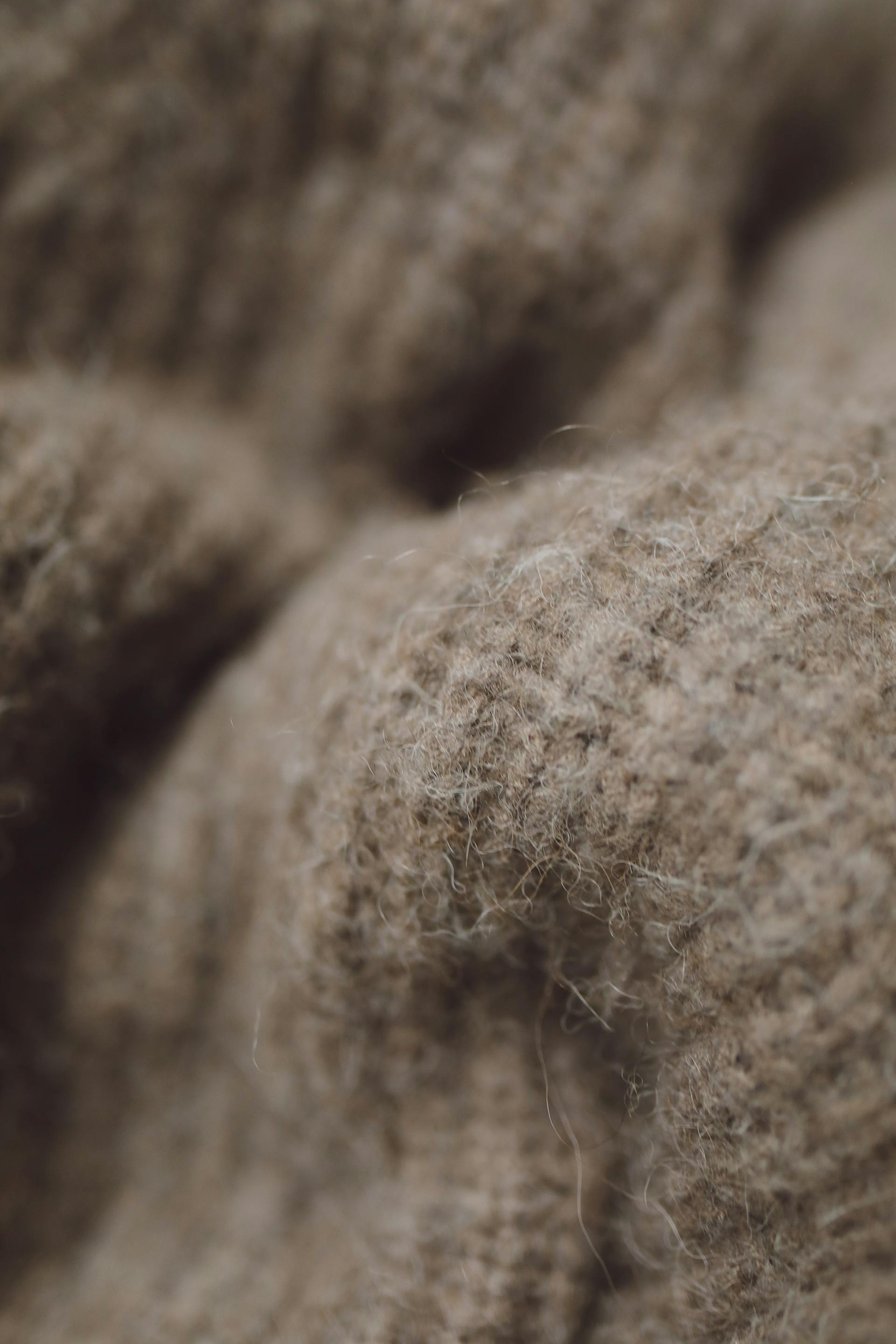 Brown wool knit fabric showing rib texture