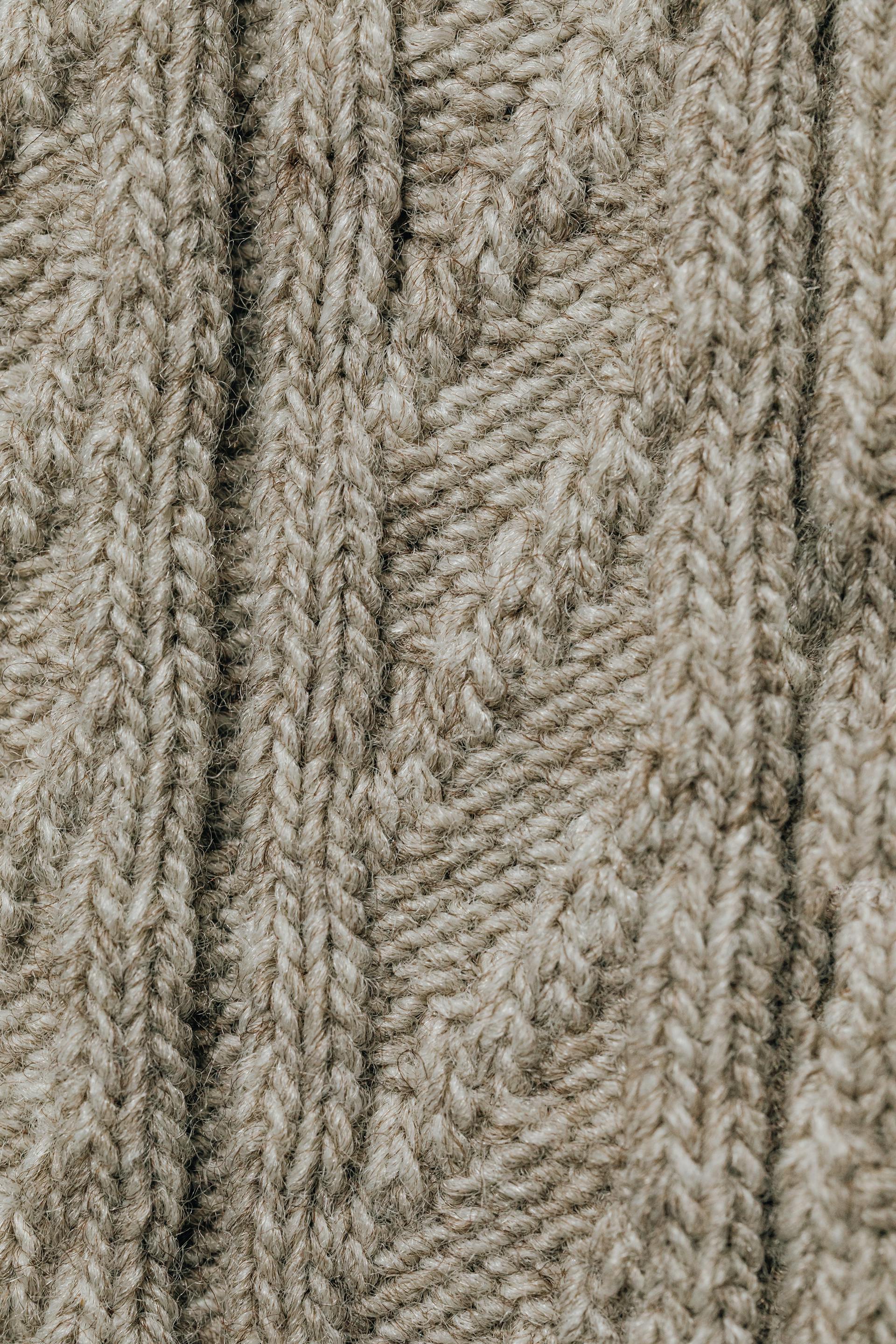 Close-up of cable-knit fabric showing texture