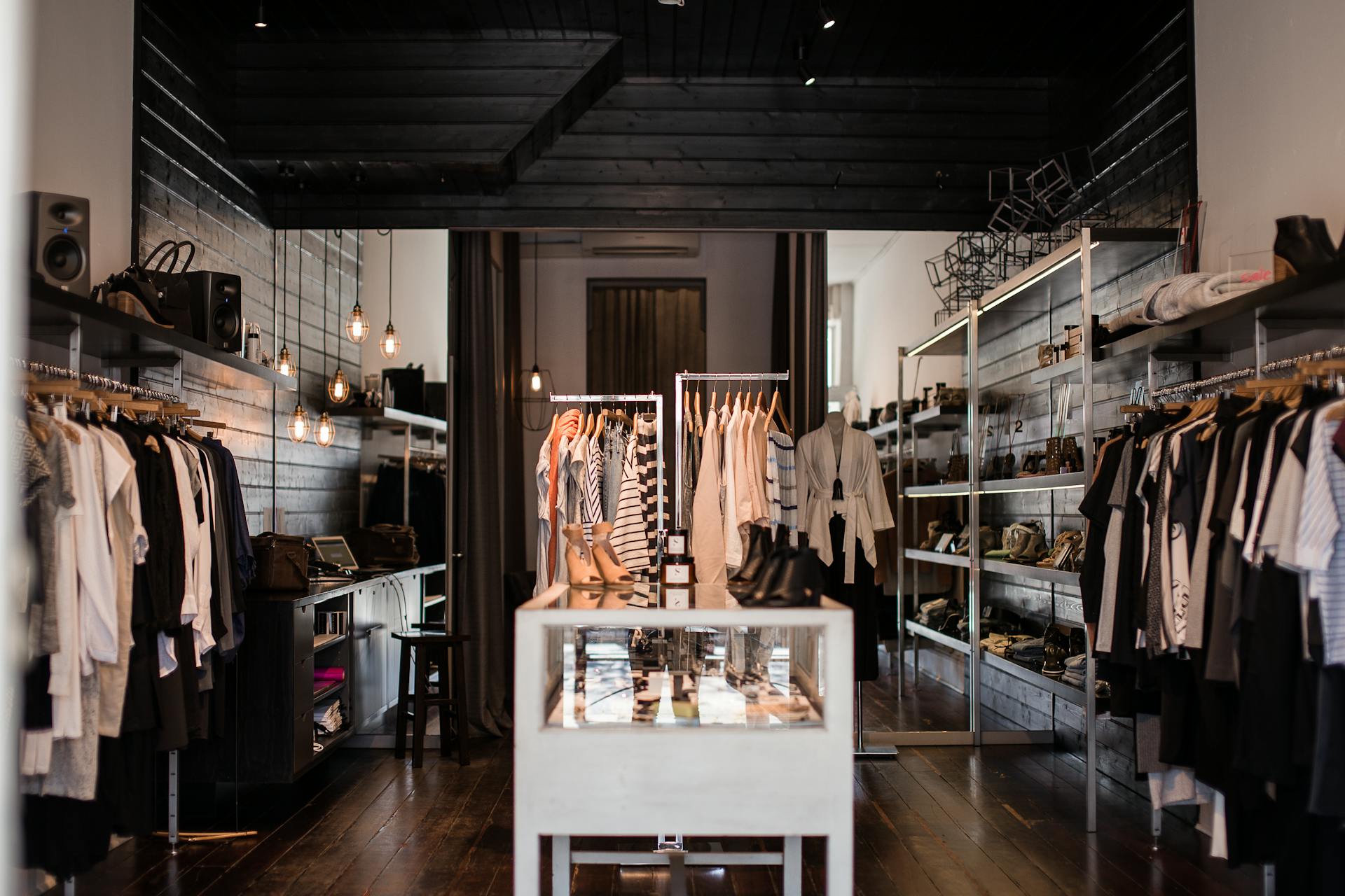 Curated rack of seasonal apparel inside a fashion retail interior